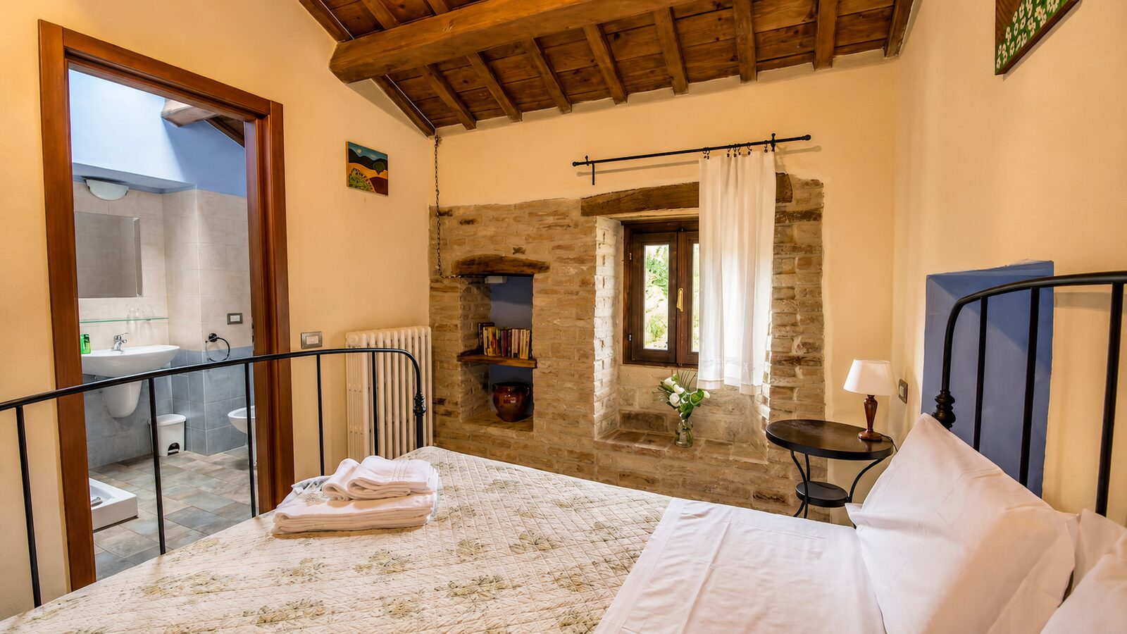 Bedroom with stone wall